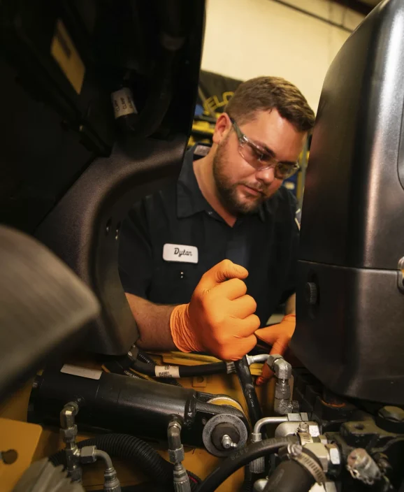 tech-working-on-forklift