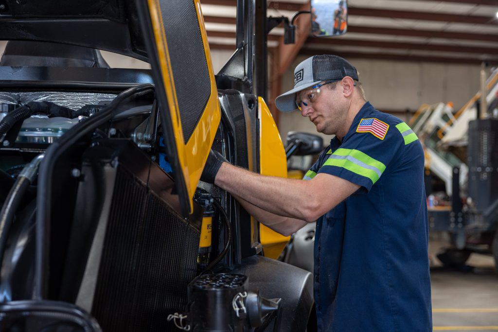 Burns JCB technician performing preventive maintenance